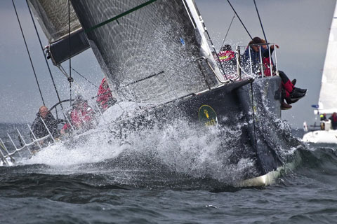 Vanquish splashes through a wave