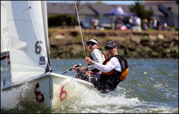 father and son sailing in an FJ